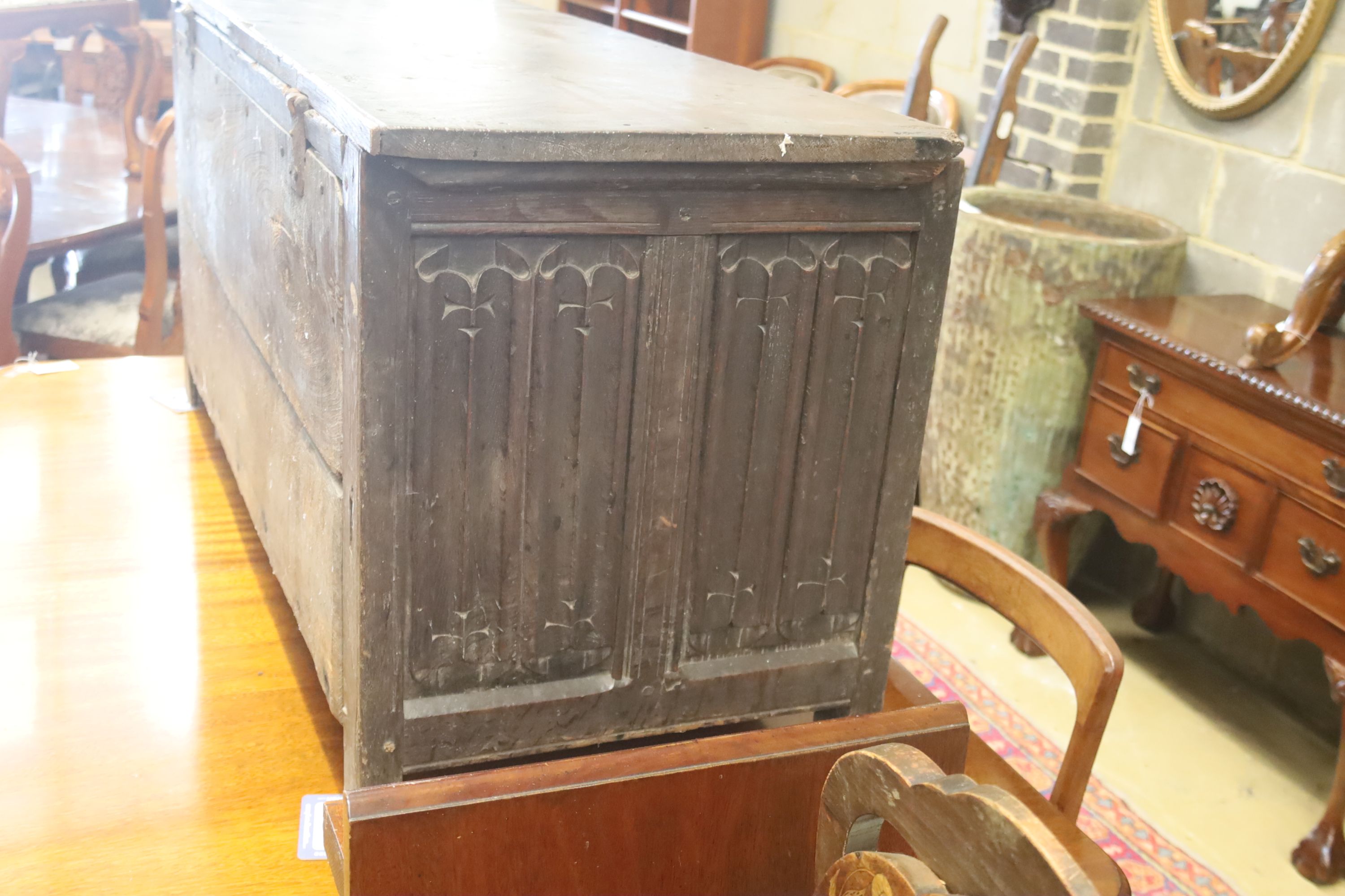 A carved and panelled oak chest, length 129cm, depth 51cm, height 63cm